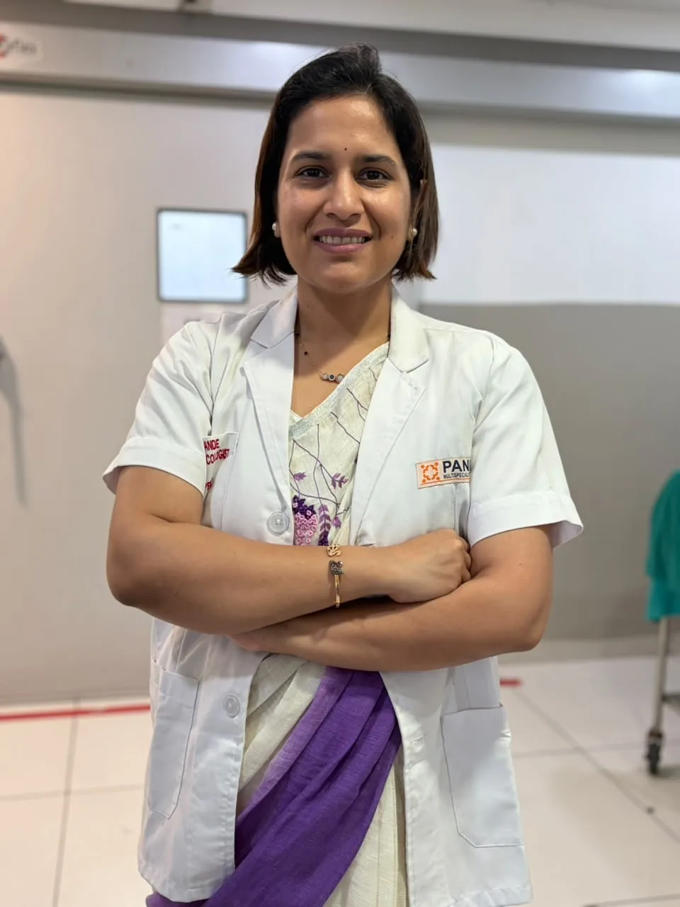 Dr. Anushree Pande standing in a clinical room