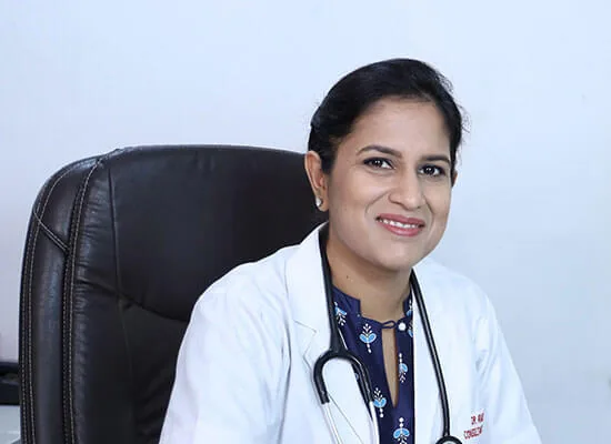 Dr. Anushree Pande in a white coat portrait